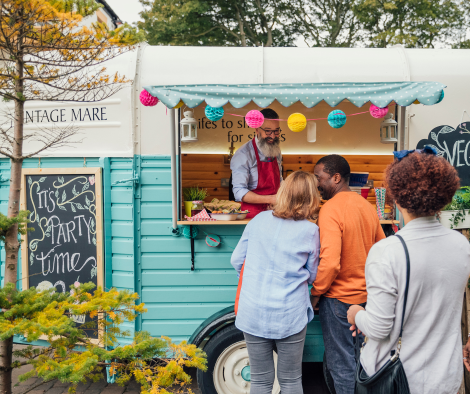Blue Food Truck serving guests