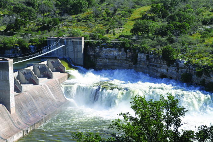 Aerial image of Inks Lake looking upstream over the spillway of Inks Dam in Burnet Count and Llano County, Texas. Legacy of the Lower Colorado River Authority.