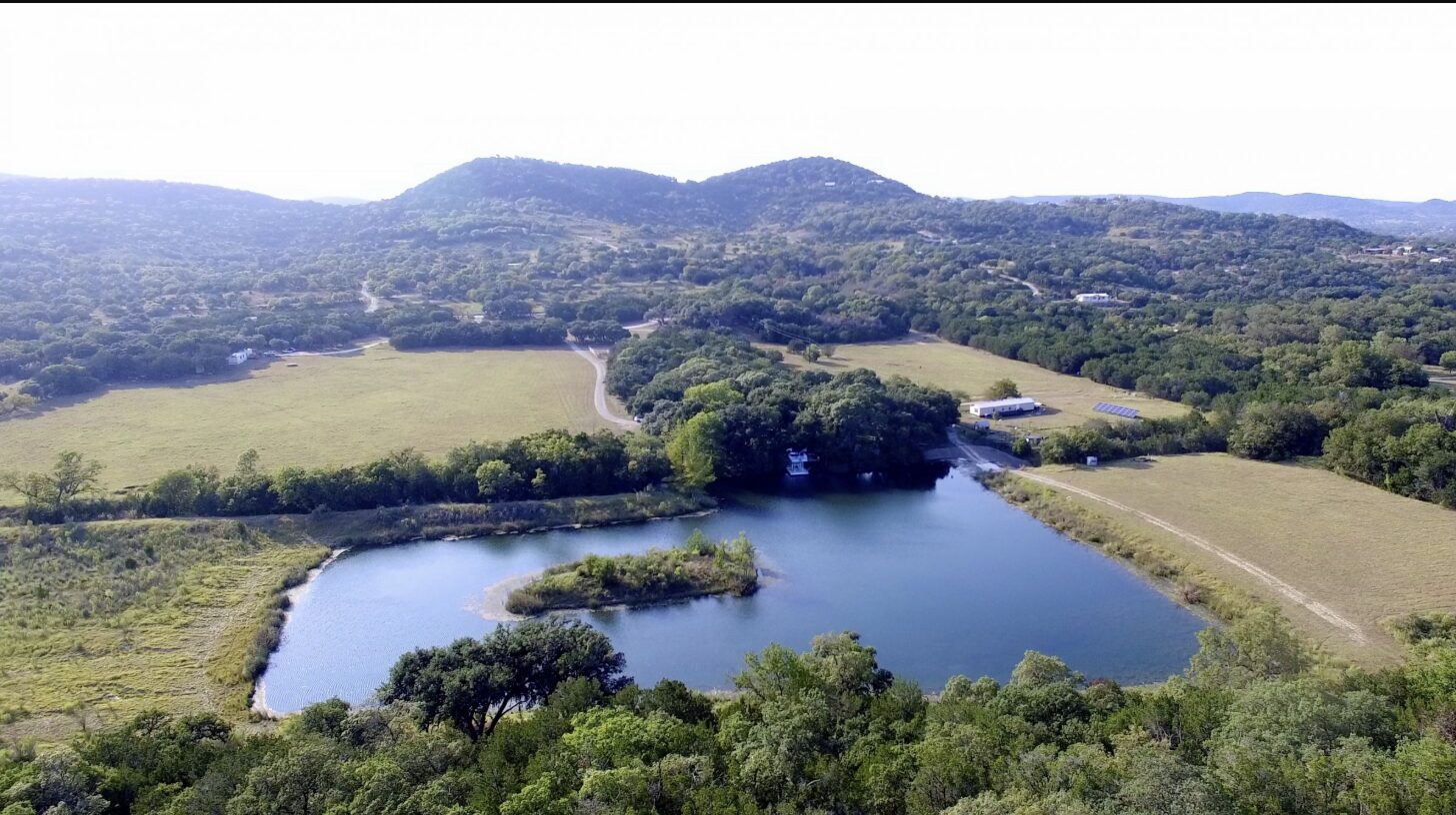 Aerial view of a lake in Bandera County, Texas, part of the Texas Hill Country popular with new homebuyers in 2026.