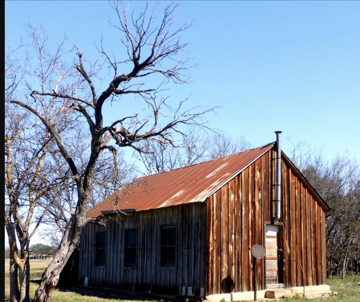 A weathered barn on a ranch property in Medina, Texas, in the Texas Hill Country.