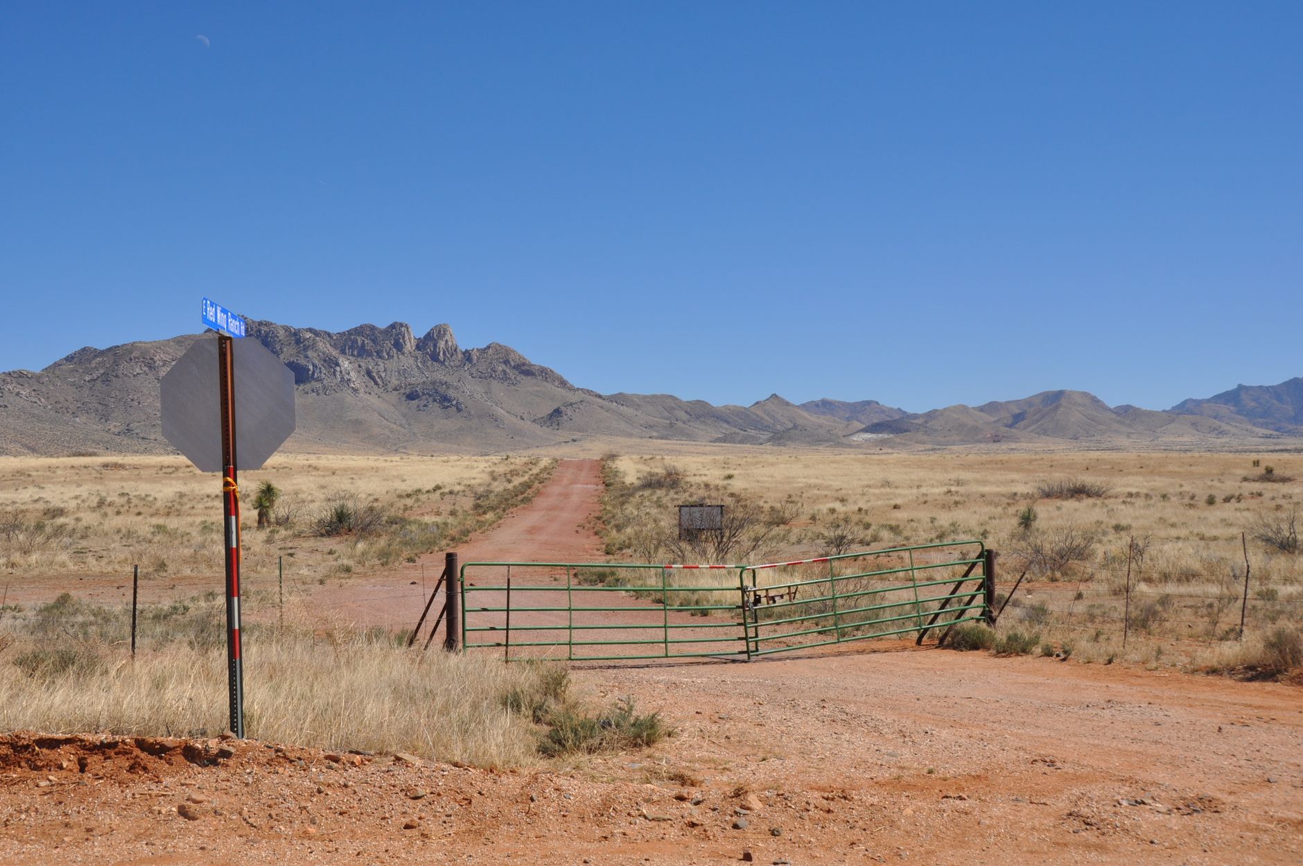 Broker walking a ranch property boundary with a landowner during a site visit