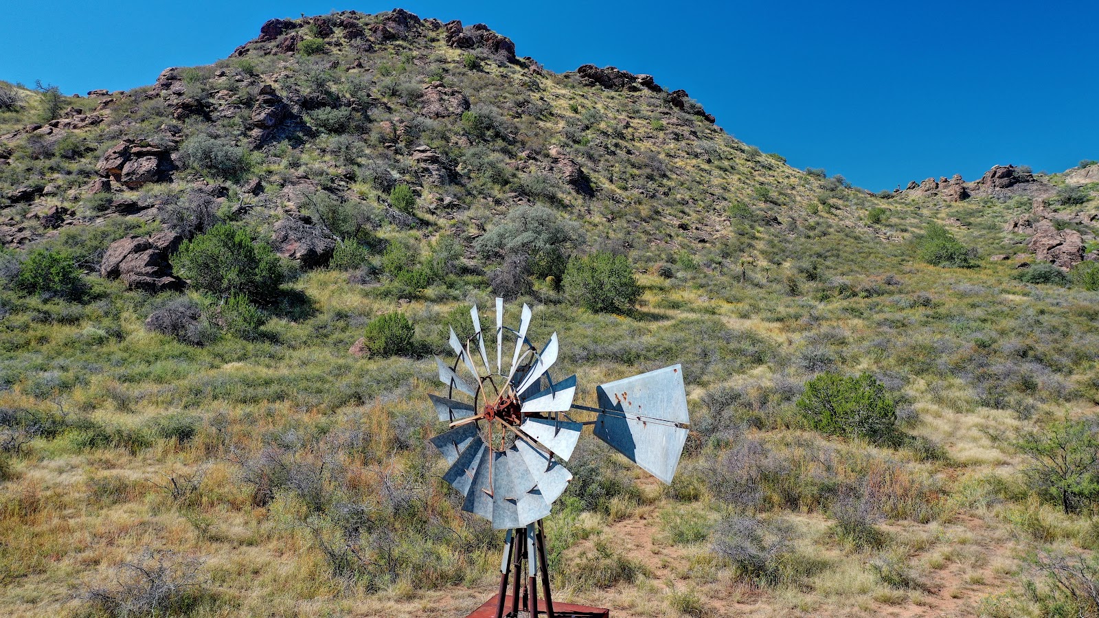 Well pump and water storage tank on a working ranch in Jeff Davis County Texas
